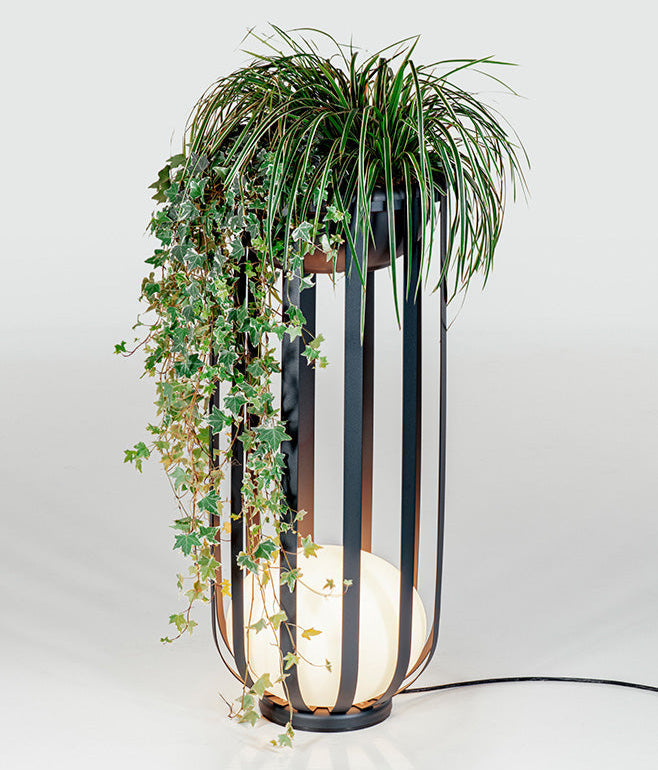 Bols_outdoor_floor_lamp_tall_in_black_thumbnail with planter accessory and greenery