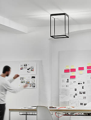 Reflex Ceiling 300 x 450 Black Finish in Home Office with Man