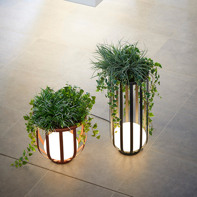 Bols outdoor floor lamp in short red and tall black top angled view