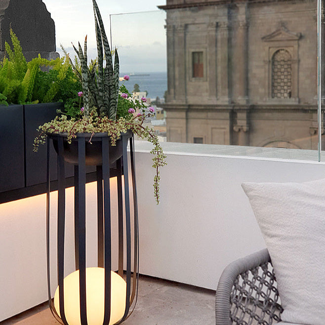 Bols outdoor floor lamp tall in black with plants on roof top terrace