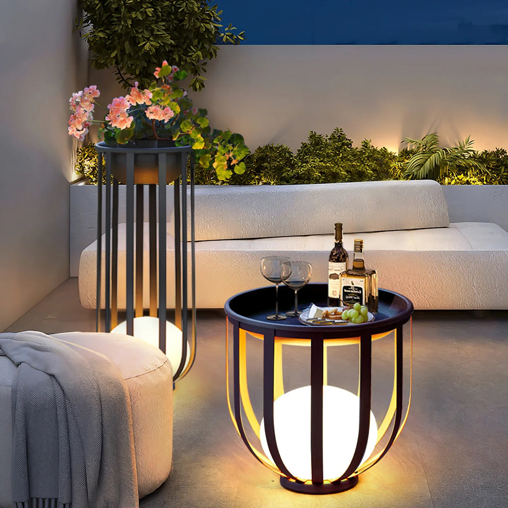 Bols outdoor floor lamps in short and tall in anthracite on terrace with sofa and poof