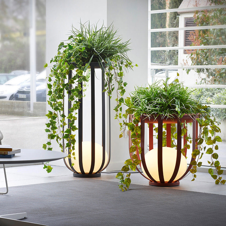 Bols outdoor floor lamps in short red and tall black in waiting room