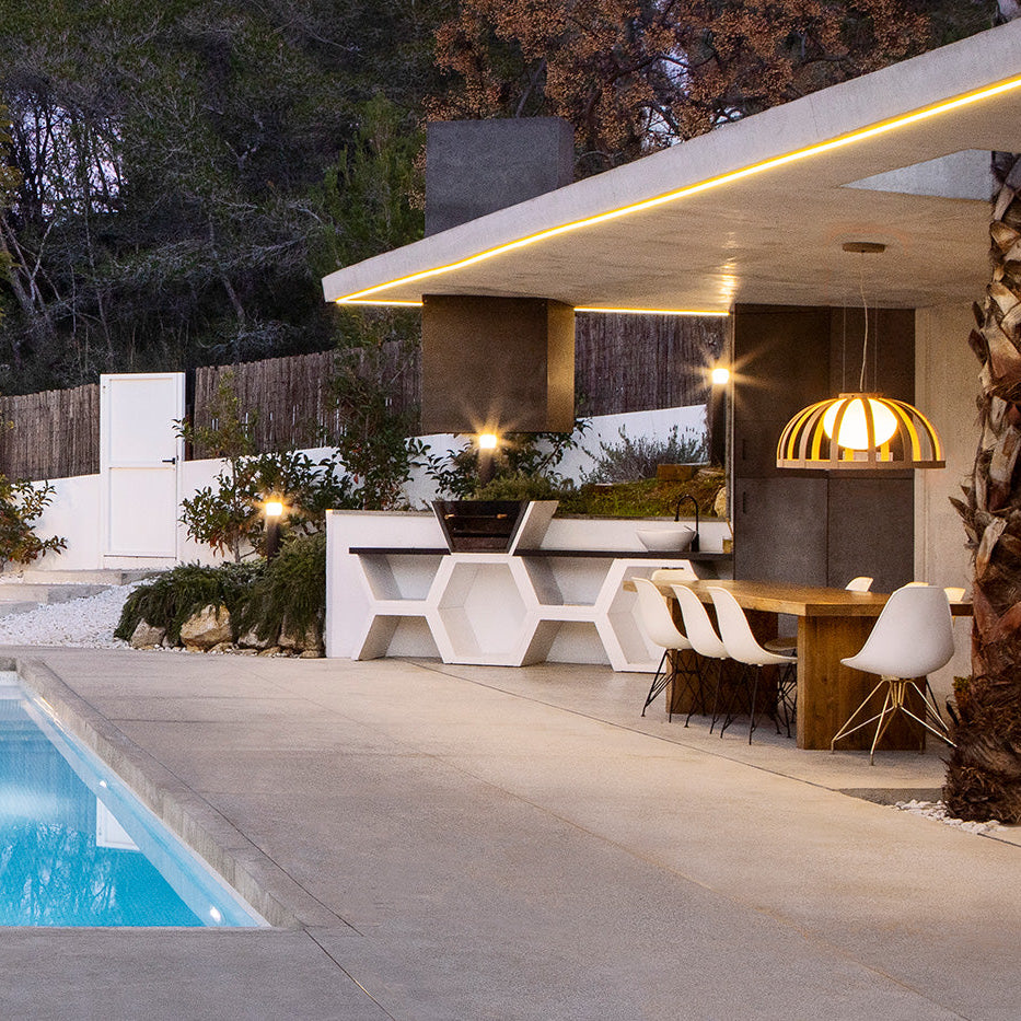 Bols pendant light in beige over outdoor dining table