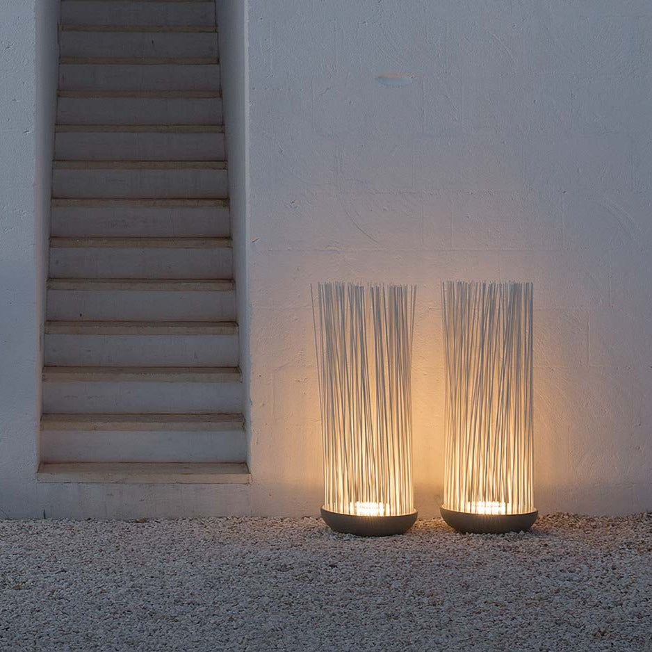 Don't Touch outdoor floor lamps by wall next to steps