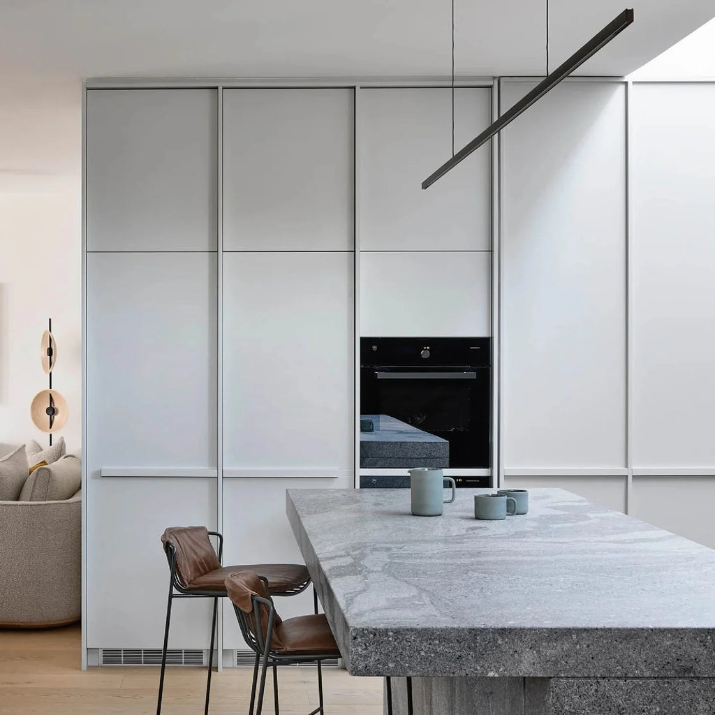 Highline Linear Pendant in Black over Grey Marble Kitchen Island
