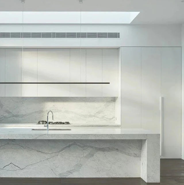 Highline Linear Pendant in Black over White Marble Kitchen Island