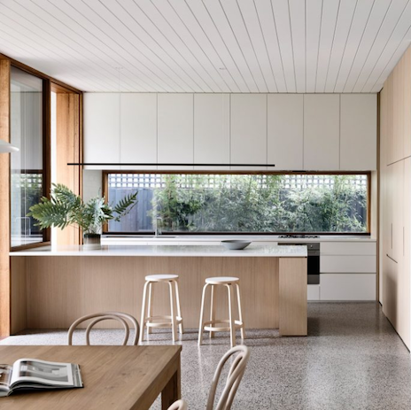 Highline Linear Pendant in Black over White and Light Wood Kitchen Island