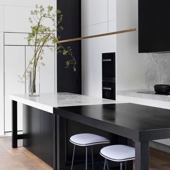 Highline Linear Pendant in Brass with Black and White Kitchen