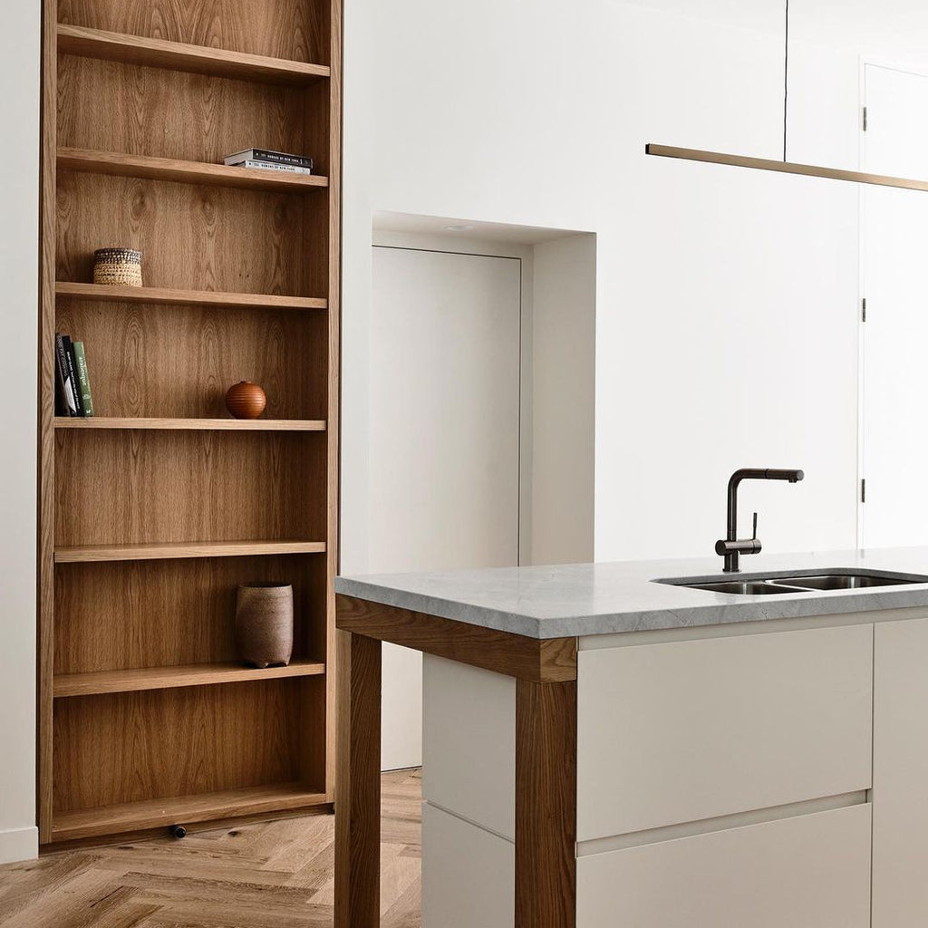 Highline Linear Pendant in Patina Brass over Modern Kitchen Island
