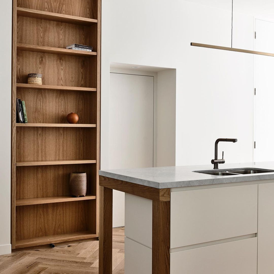 Highline Linear Pendant in Patina Brass over Modern Kitchen Island