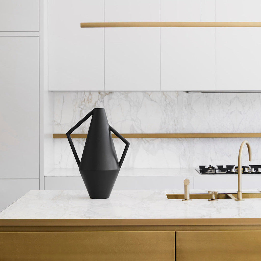 Highline Linear Pendant in Satin Brass with Black Vase over Kitchen Island