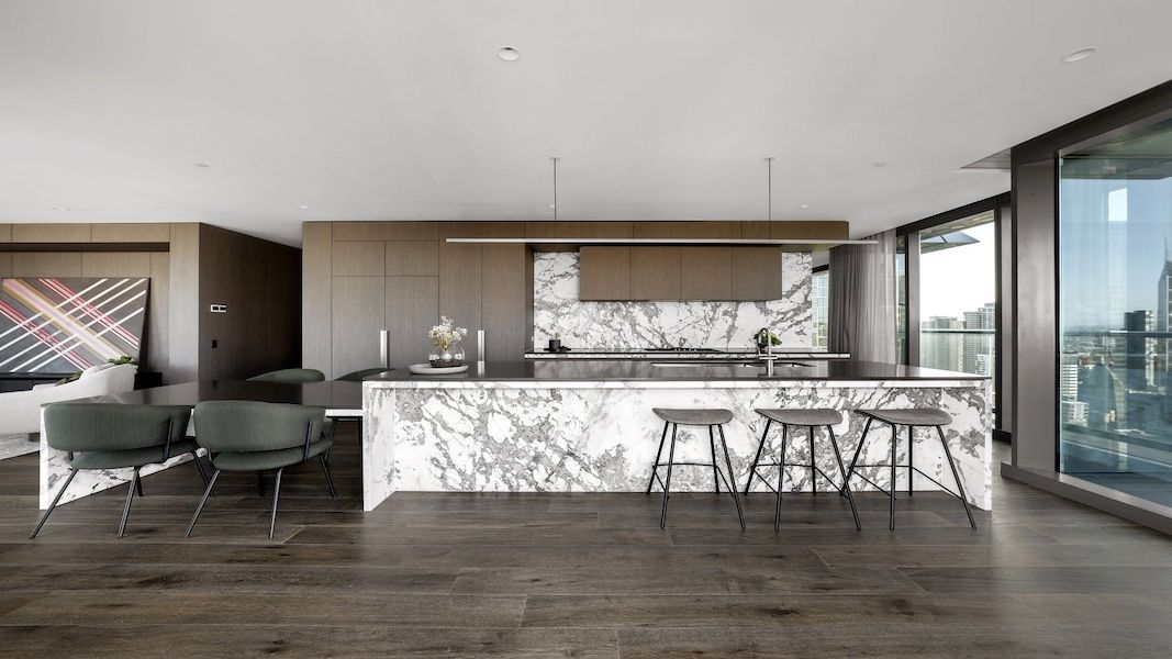 Highline Linear Pendant in White over Carrara Marble Kitchen Island