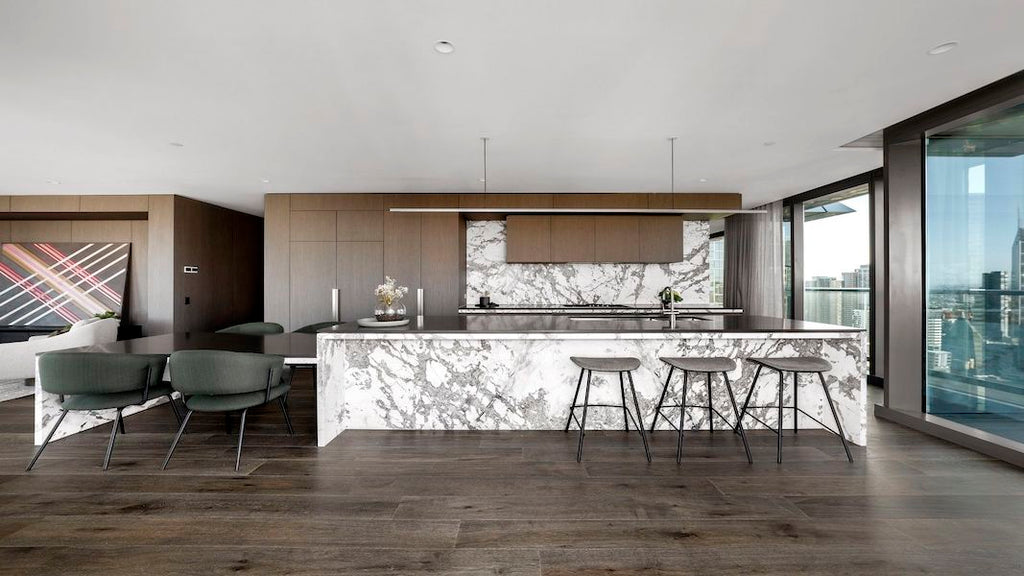 Highline Linear Pendant in White over Carrara Marble Kitchen Island
