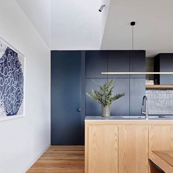Highline Linear Pendant with Satin Brass in Kitchen with Spot Light in Sky Light